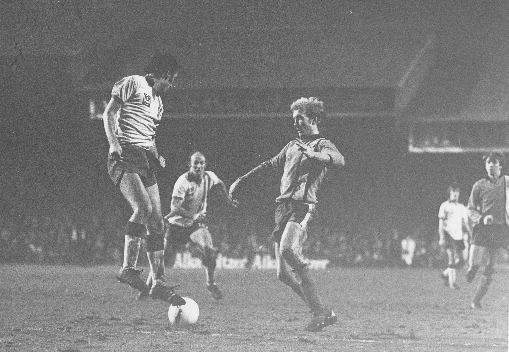 Ron Futcher looks to lay the ball off