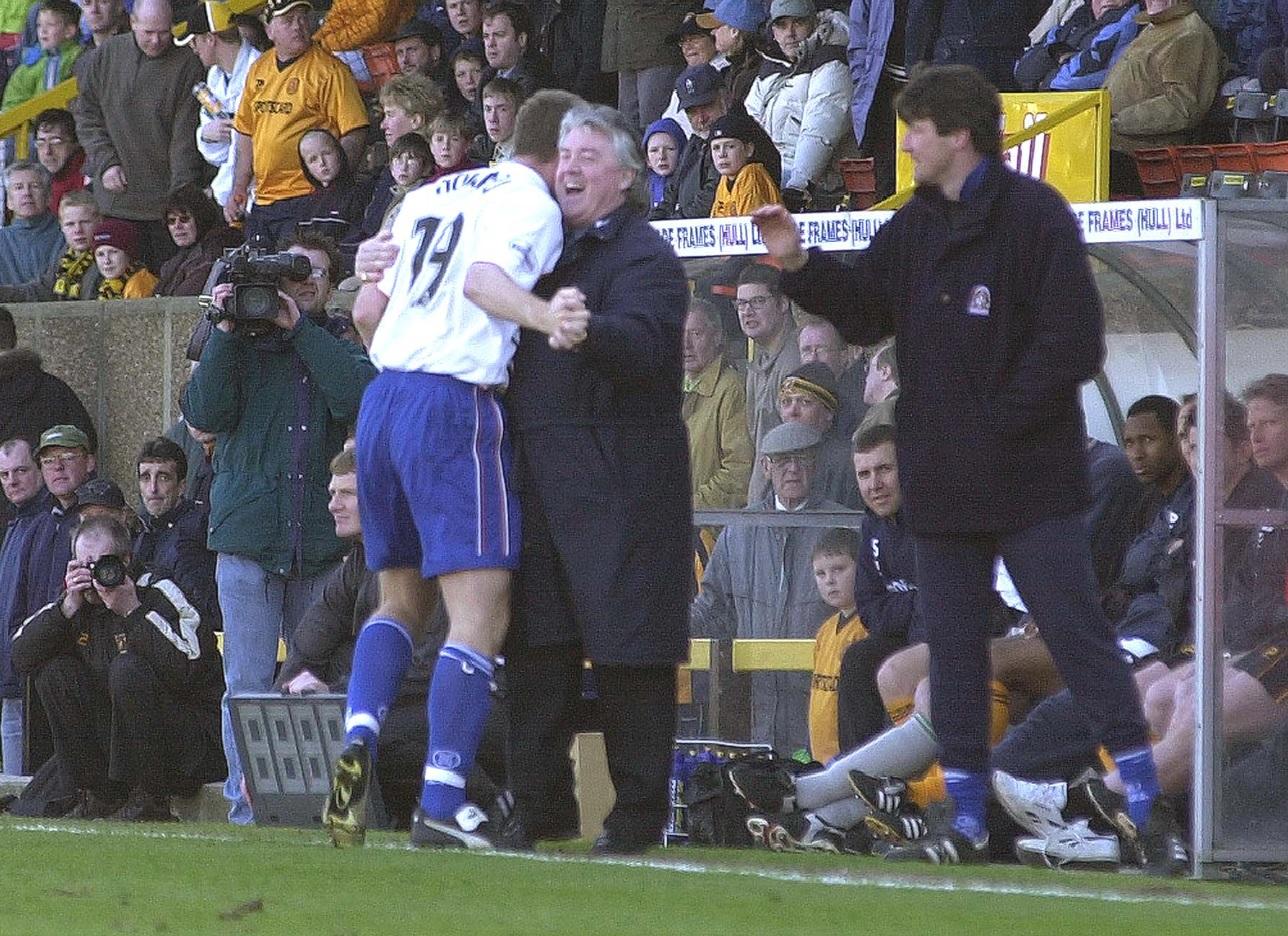 Steve Howard goes over to the bench after netting his hat-trick goal
