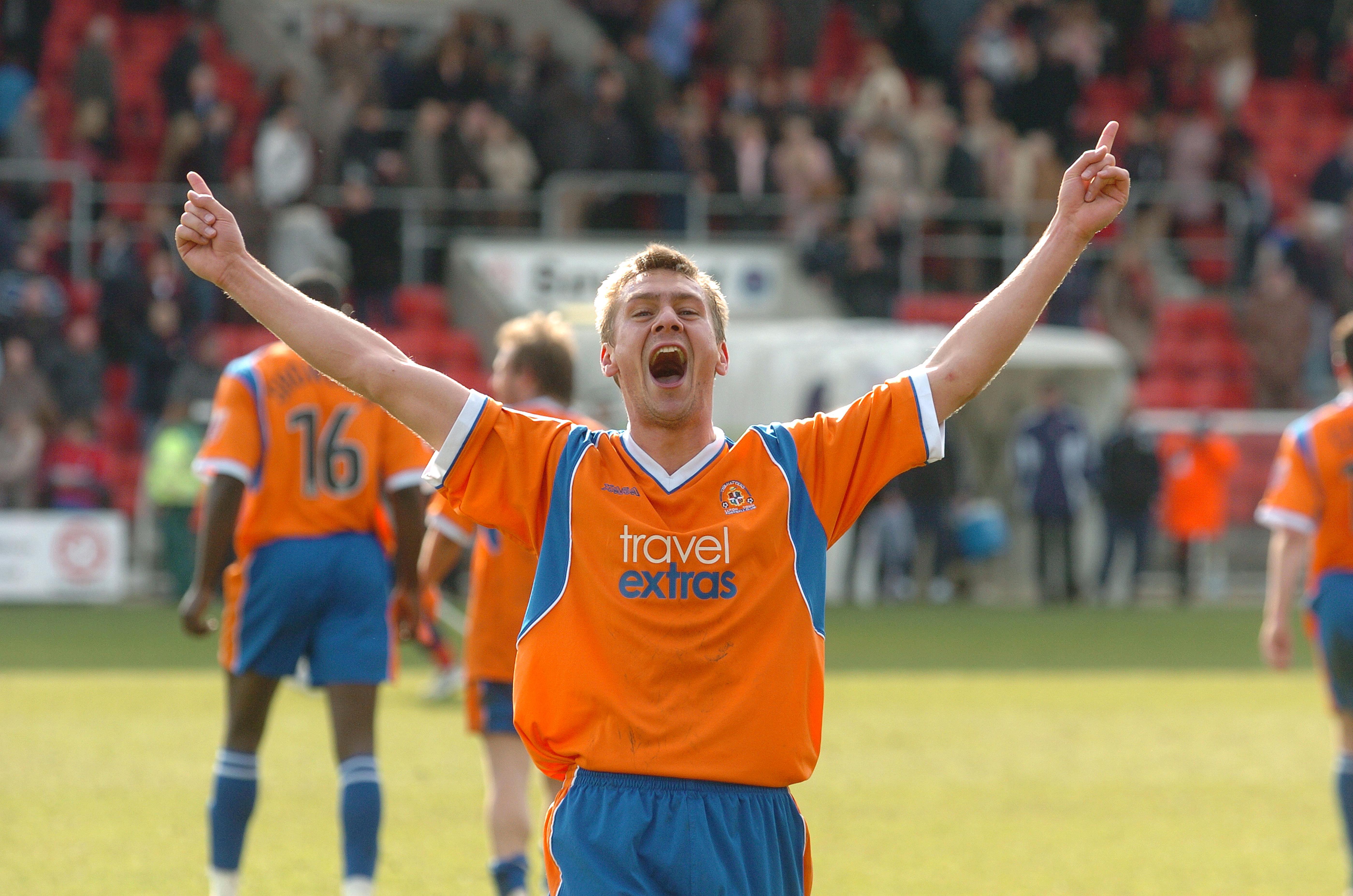 Sol Davis celebrates in front of the Luton supporters