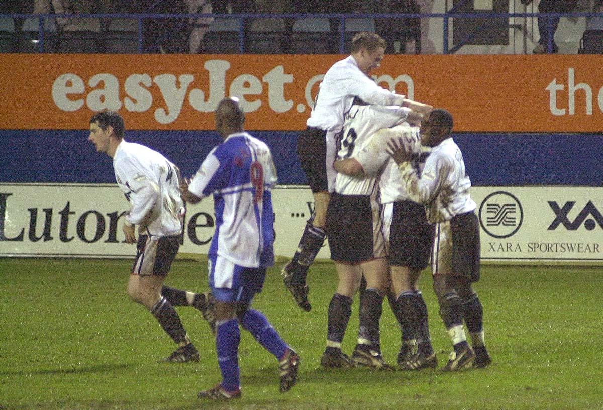 Steve Howard is mobbed after opening the scoring