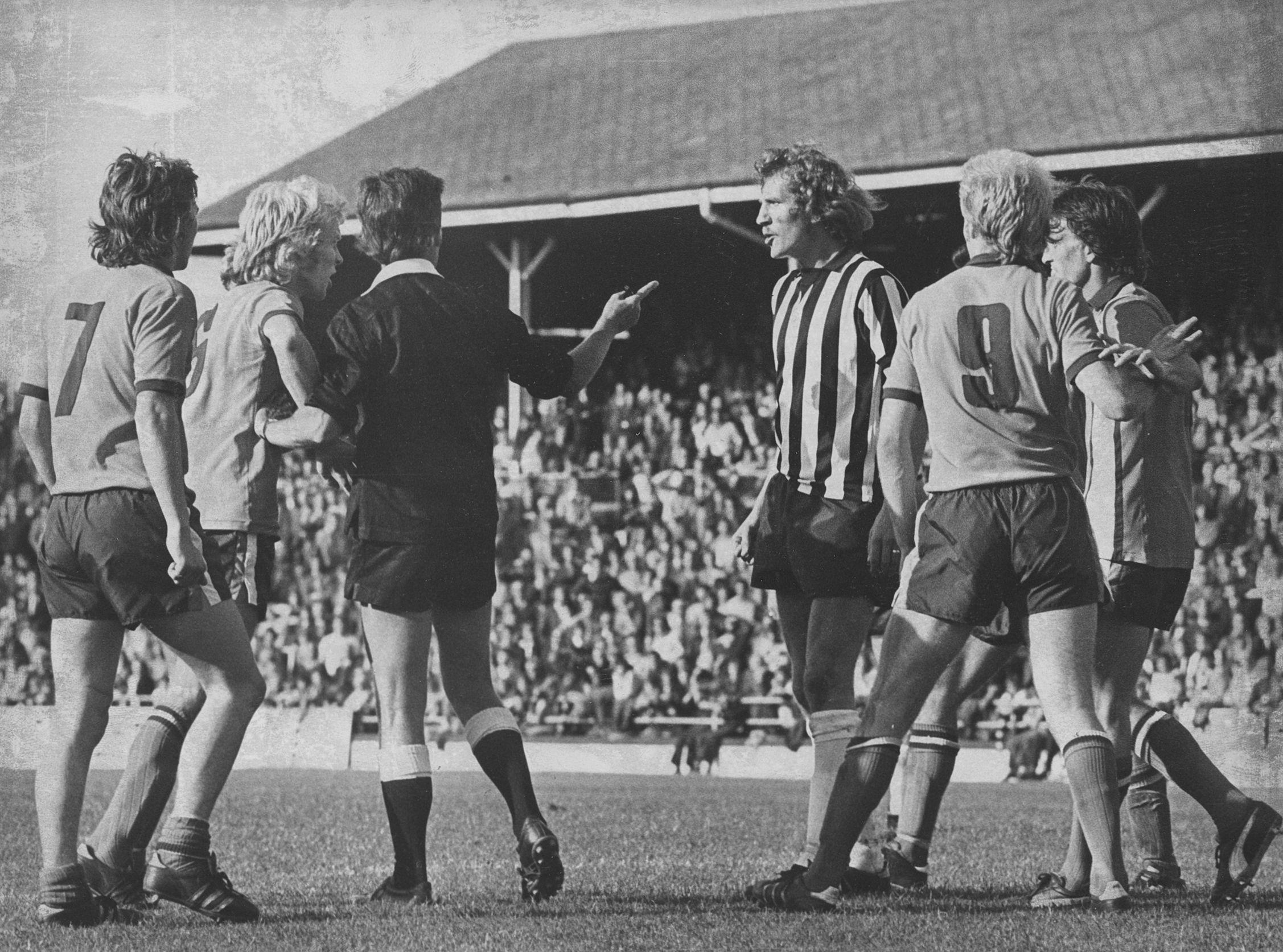 Paul Futcher gets into an argument with County's Brian Stubbs